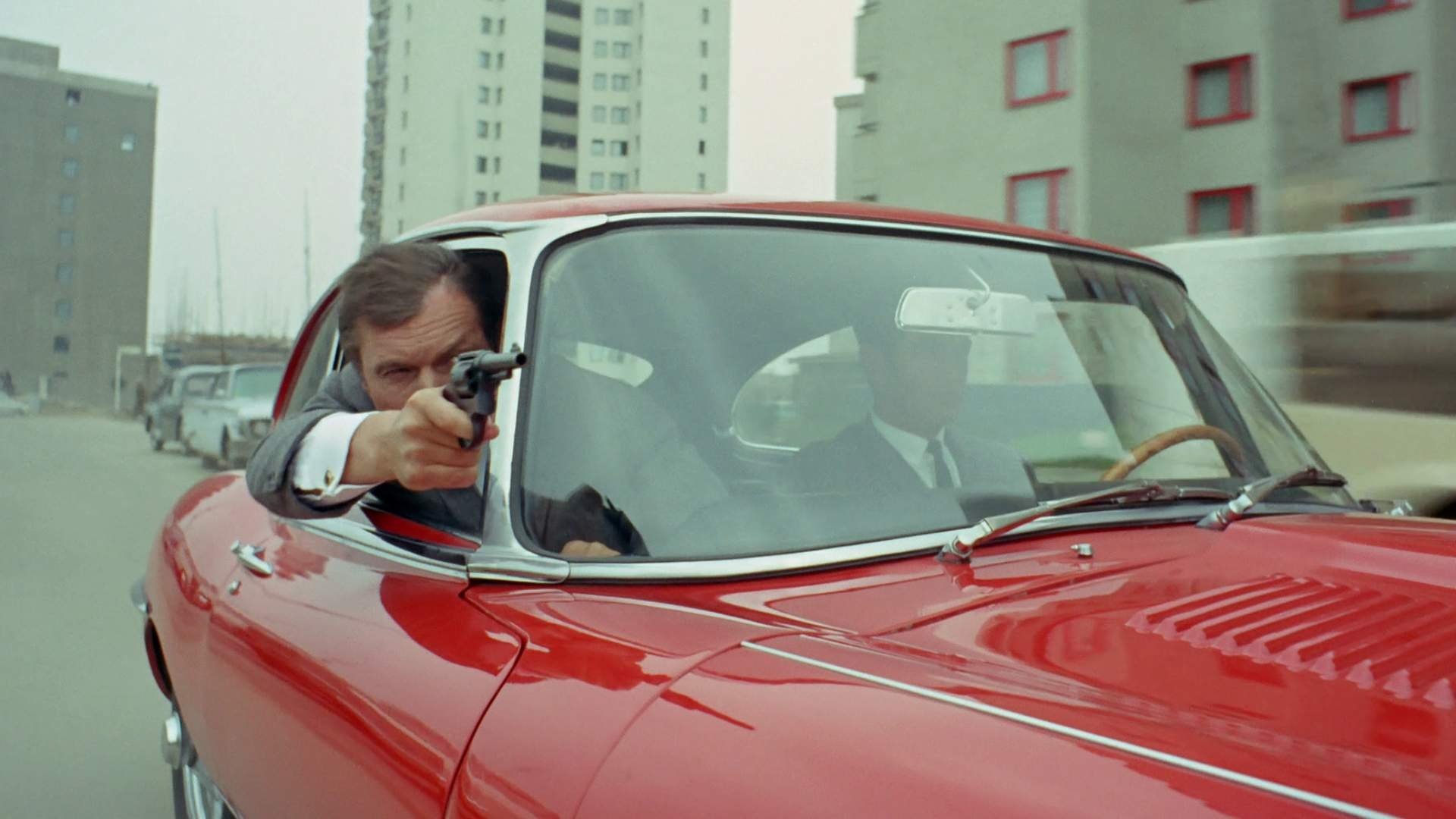 Jerry Cotton: Death in the Red Jaguar Background