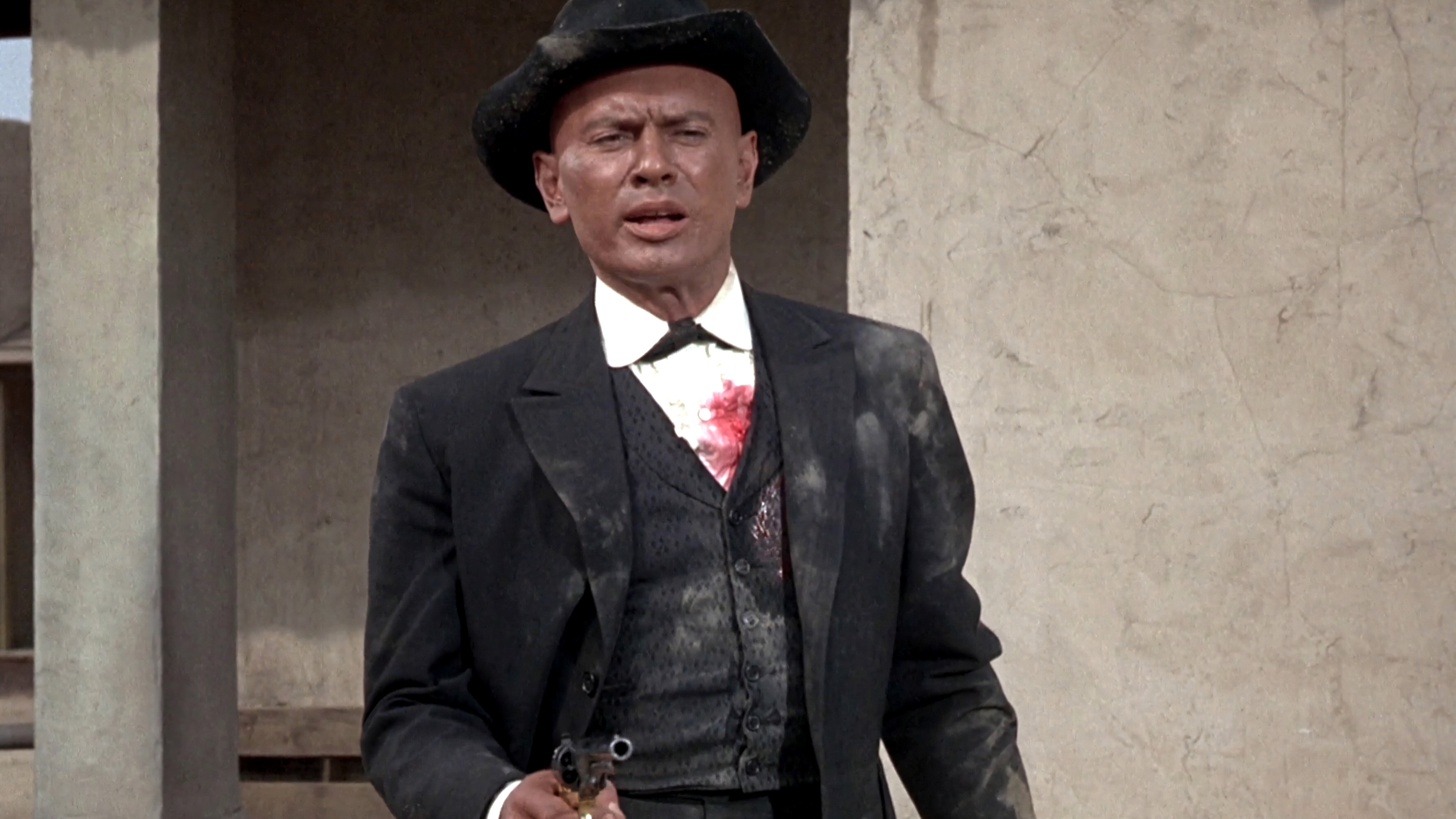 Invitation to a Gunfighter Background