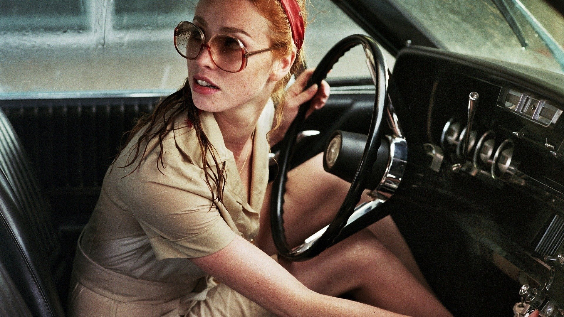 The Lady in the Car with Glasses and a Gun Background